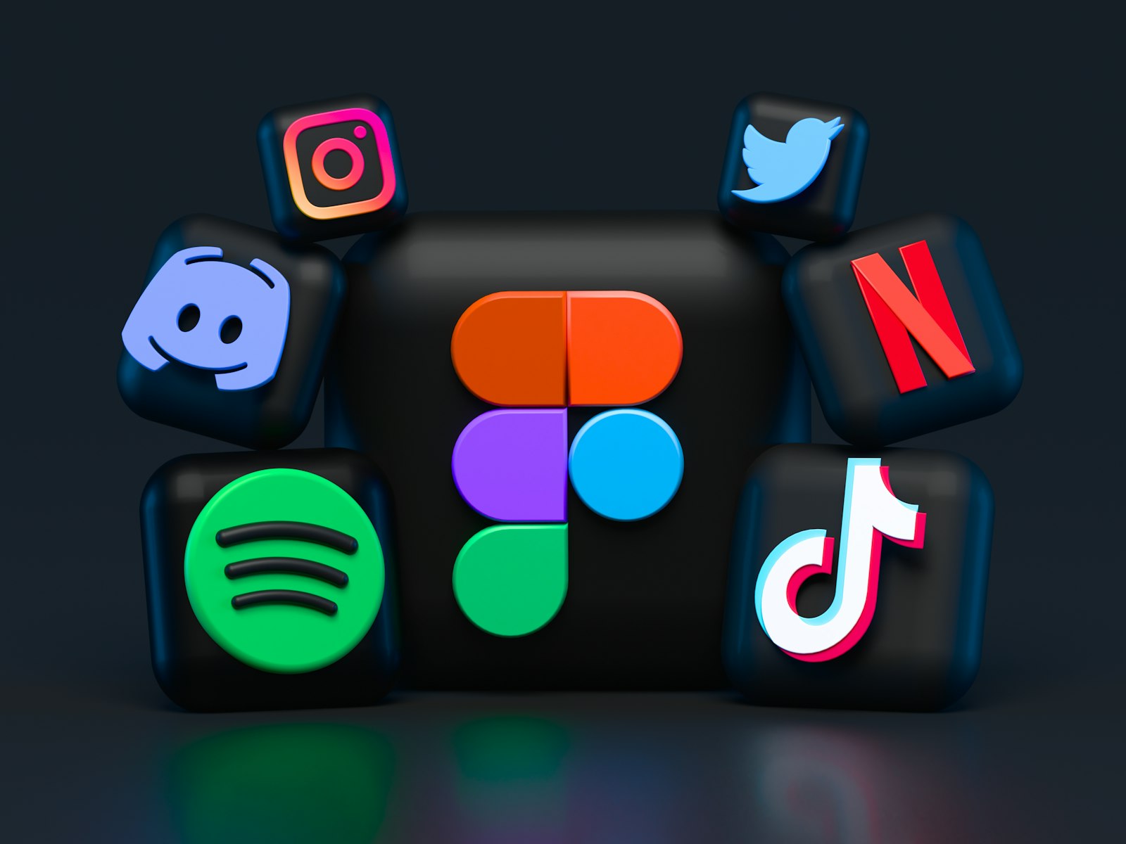 Multiple screens showing social media platforms — TikTok, YouTube, Meta